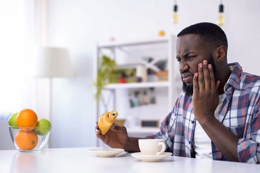 Man with tooth sensitivity