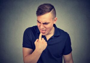 Man with bitter taste in his mouth