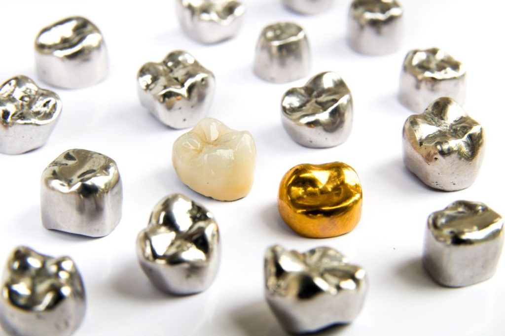 A variety of different colored dental crowns